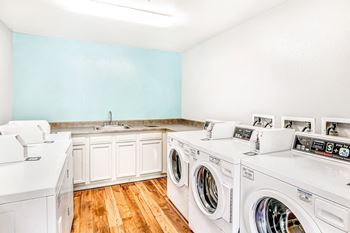 Shared laundry facility with sink and folding counters